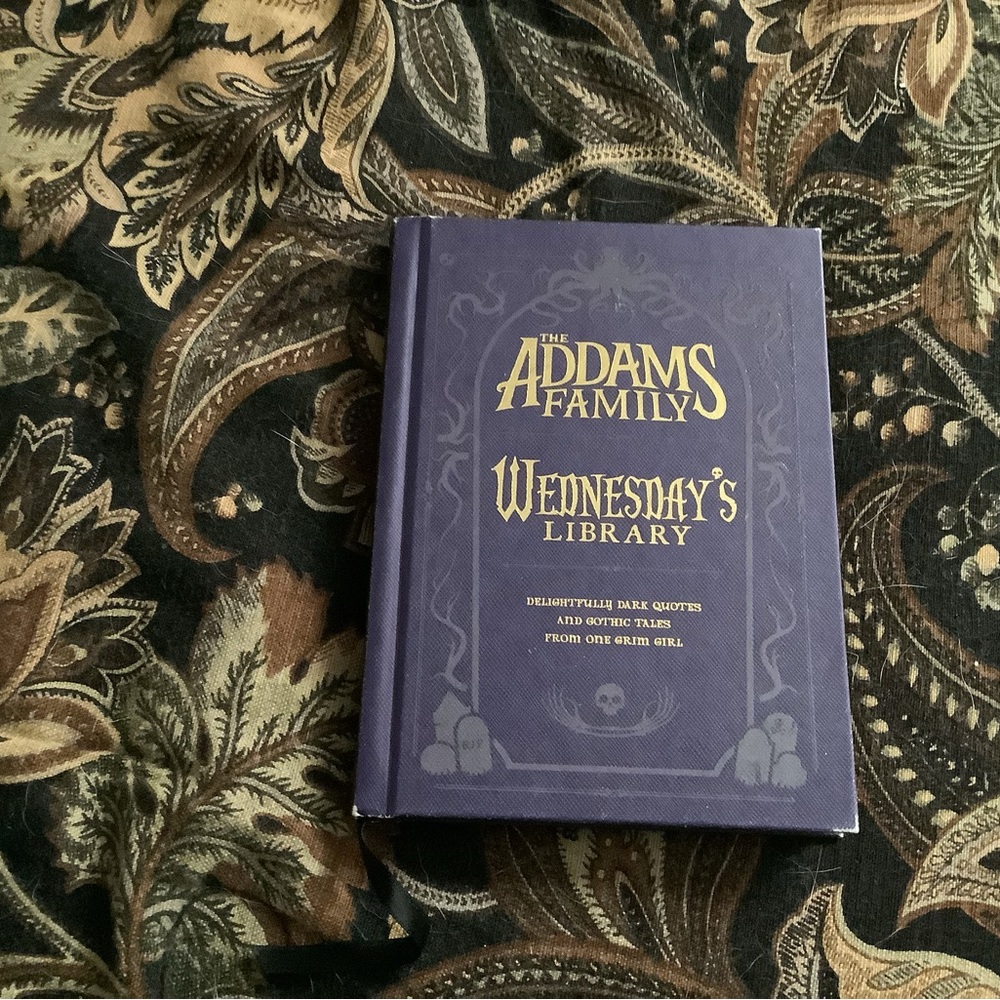The Addams Family WEDNESDAY’S library hardcover purple book